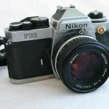 NIKON FE 2 FILM CAMERA + NIKKOR 5Omm F1.4 LENS + strap